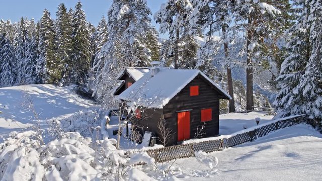Aerial shot of a hut in the Swiss mountains during the winter. Recorded in 5.2k raw with the DJI Inspire 2 and downscaled to 4k in post-production. 