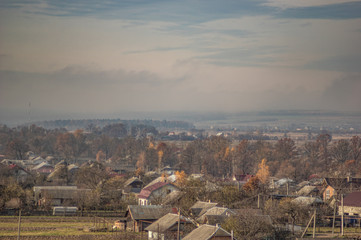 Village in the autumn afternoon in a haze