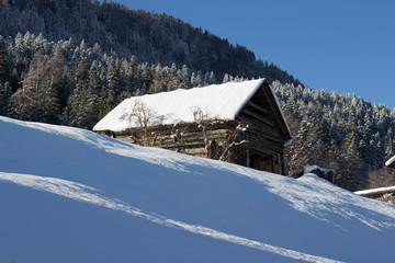 Snow-covered chalet in the Swiss Alps