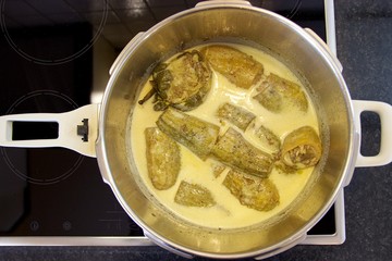 Top view of a large pot with cooked homemade Greek traditional food of 