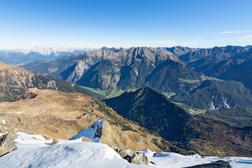 View from the summit of a mountain (Fundusfeiler, Oetztal Alps, Austria) at a clear sunny day in autumn to the Ötztal Valley and Stubai Alps.