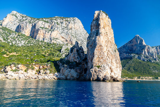 The monolith of Pedra Longa, Baunei, province of Ogliastra, East Sardinia, Italy. The rocky spire which rises majestically out of the sea. Holidays in Sardinia.