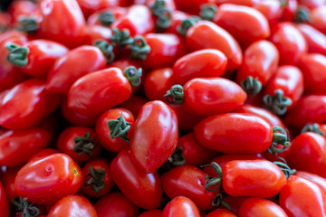 Red ripe tomatoes on farmets market close up