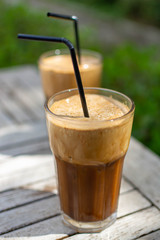 Traditional greek cold coffee Frappe made from water, instant coffee and ice cubes