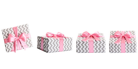 set of gift boxes with pink bow on white