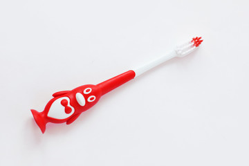 Cute kids toothbrushes in a shape of penguins on a white background isolated. Funny teaching...