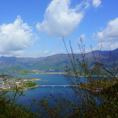 Blue sky and blue lake view from the top of the mountain Tenjo-Yama. Landscape beautiful Lake Kawaguchiko, Japan