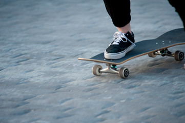Fototapeta na wymiar skate foot put on front of skate with black shoes