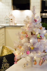 Holiday ginger house. Merry christmas and happy new year. Kitchen. Newyear tree with toy. Sweet glass toy