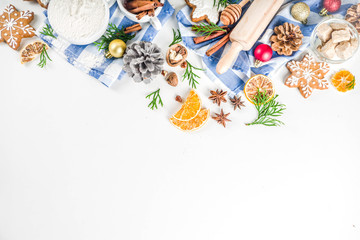 Fototapeta na wymiar Christmas baking background. Christmas sweet cooking ingredients on white table. Ingredient for cooking christmas pastry, cookies and cakes, Flatlay on white table, top view with copy space