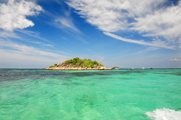 Talu Island. Koh Talu in Tarutao National Park of Satun province Thailand.Mountain and beach with blue sky cloudy. Cave entrance. Cave hole inside. Sea and mountain hope.