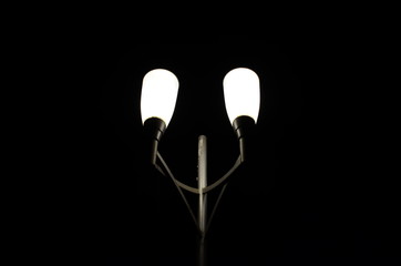 Elegant illuminated Street Light and lamp in Black Background