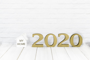 2020 new year and home  on white wood table over white background with copy space , Real estate concept