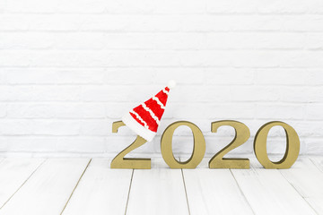 2020 new year and christmas hat on white wood table over white background  with copy space