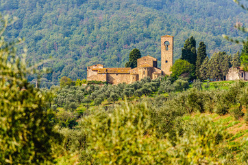 Fototapeta na wymiar View of Ss. Mary and Leonard parsih church in Artimino with typical tuscan landscape