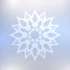 Abstract blue snowflake with blurred effect.