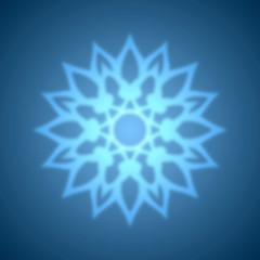 Abstract blue snowflake with blurred effect.