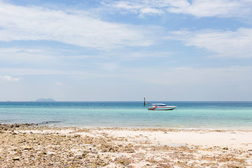 Fototapeta na wymiar Speedboat on the paradise tropical beach.