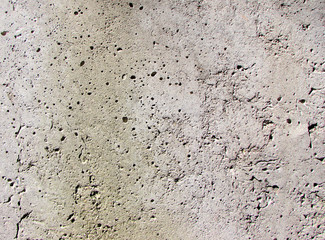Concrete, gray, white wall. Wall in the holes.