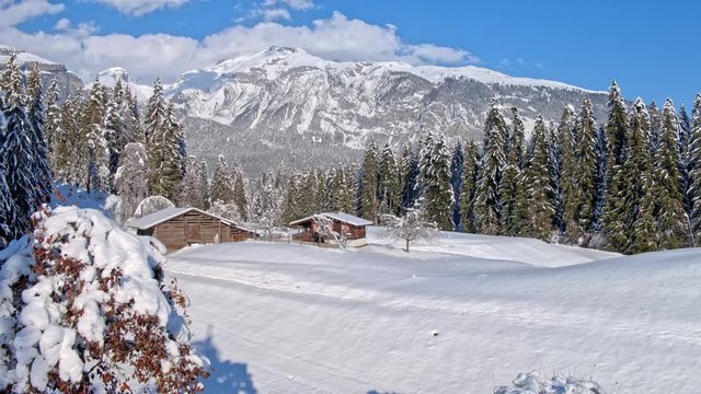 Aerial shot of a hut in the Swiss mountains during the winter. Recorded in 5.2k raw with the DJI Inspire 2 and downscaled to 4k in post-production. 