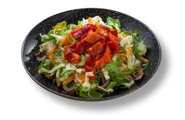 Fresh green salad in beautiful black modern plate