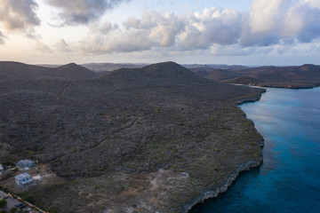 Aerial view of coast of Curaçao in the Caribbean Sea with turquoise water, cliff and beach