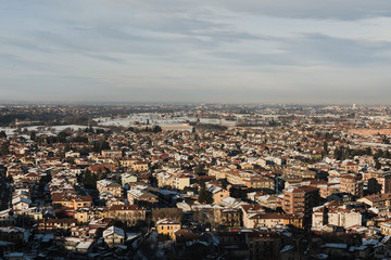 Obraz premium Italy, Cuneo city, top view of the city, winter, snow, house roofs