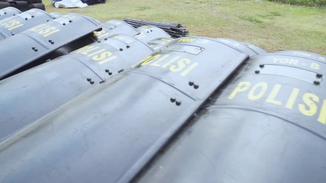 JAKARTA, Indonesia - November 18, 2019: Piles of shields, vests and batons for equipment of crowd control from the group of riot