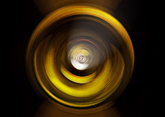 Abstract yellow background of colorful spin radial motion blur.