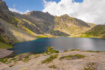 Naklejka na ściany i meble French Alps at an altitude of 2800 meters, Mountain peaks and untouched nature, clear lakes