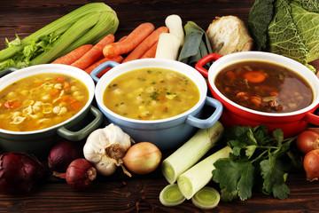 Set of soups from worldwide cuisines, healthy food. Broth with noodles, beef soup and broth with...