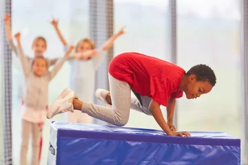 Tuinposter Children exercise fitness at a competition © Robert Kneschke