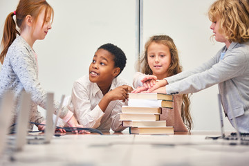 Students of a study group stack their hands