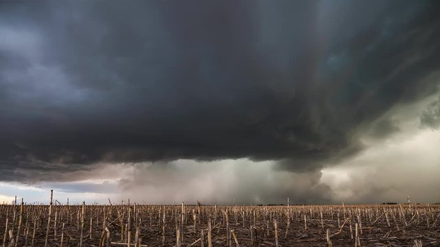 Supercell storm moving over corn field as clouds spin in the Nebraska plains.
