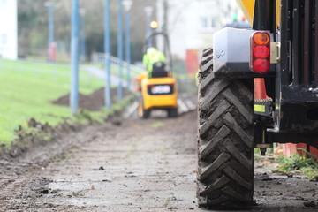 Tractors on muddy path