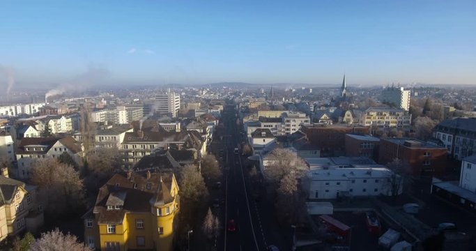 Airshot of Giessen City in Germany. The camera follows a street