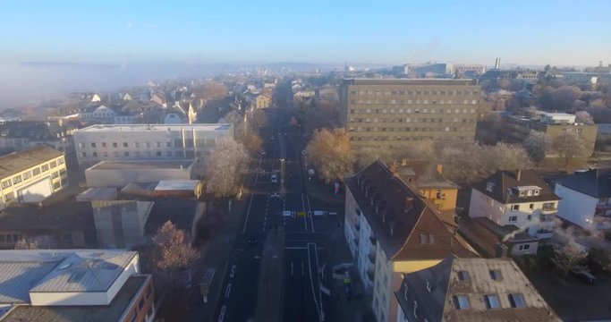 Airshot of Giessen City in Germany. The camera follows a street