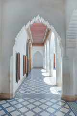 Ornamented Muqarnas pointed arches connecting the hallways of the palace, architecture intended to capture the fabulous Islamic and Moroccan style,  Bahia Palace, Marrakesh, Morocco 