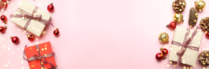 Merry Christmas and New Year congratulation background with beautiful gifts boxes, golden shiny ribbons and red balls on pink background.
