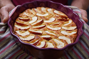 Apple pie in a ceramic bowl.