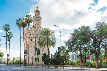 Fototapeta na wymiar SEVILLA, SPAIN - January 13, 2018: Tower of Gold (Torre del Oro) is a dodecagonal military watchtower in Seville, Spain