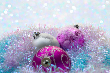 Obraz na płótnie Canvas Christmas balls with blue tinsel on the snow
