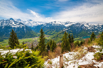 Fresh snow on mount slope on Harder Kulm - popular viewpoint over Interlaken, Swiss Alps, Switzerland