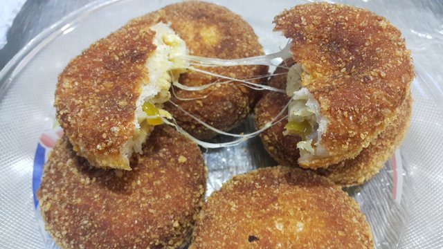 Closeup perspective view of fried pizza bombs or balls are altered form of pizza