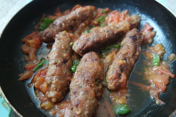 Delicious spicy home made fried kebab with green pepper