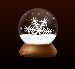 Christmas snow globe on black background.