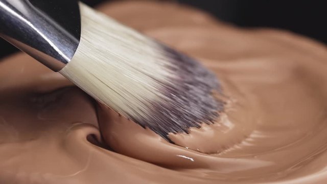 Makeup concealer cosmetic products for face skin care professional decorative cosmetics even tone perfect liquid texture white brush made from natural fibers.
