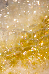 Close Up of Bath Water Bubbles Foam For Background In Yellow