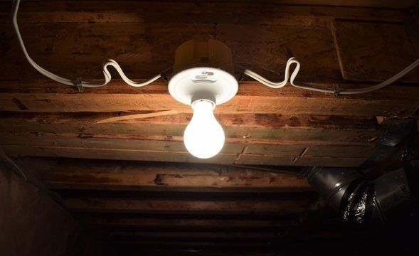 Bare Light Bulb Basement Storage Room Stock Photo - Download Image