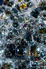 Close Up of Bath Water Bubbles Foam For Background In Black Rainbows